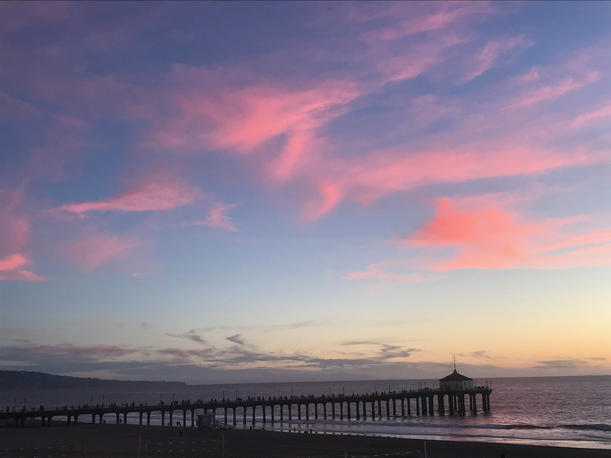 pink clouds and sunset over ocean