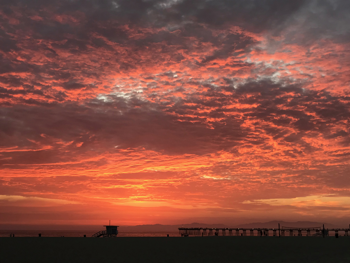 pink clouds and sunset over ocean